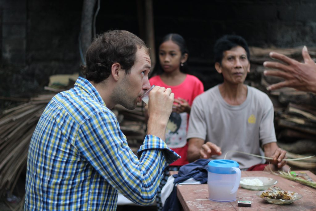 Drinking rice wine with locals in Teganan village